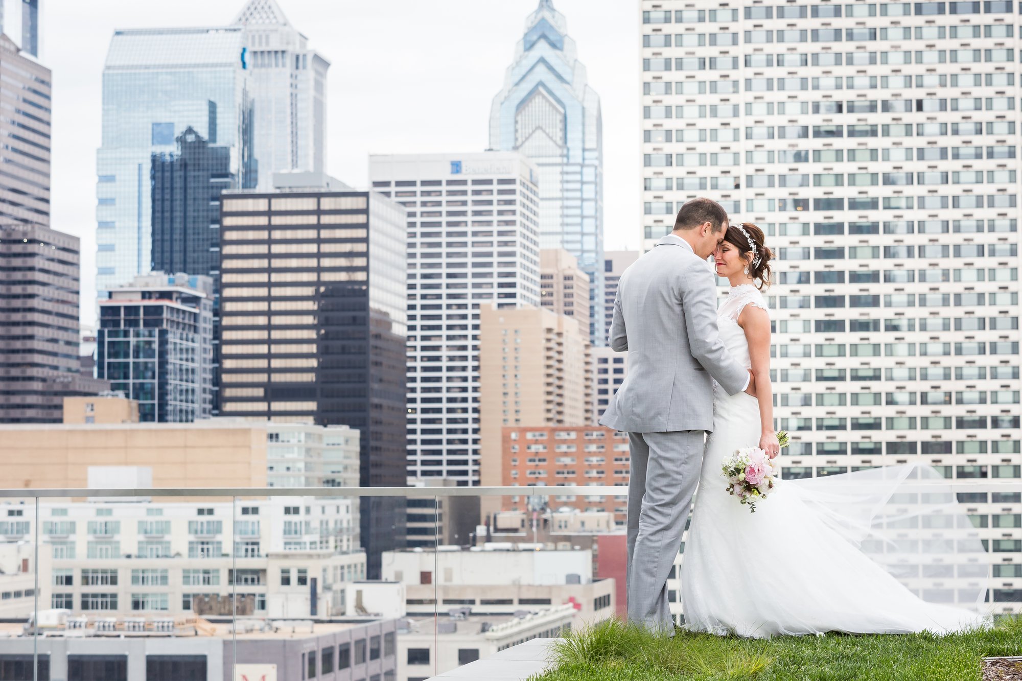 Wedding portrait on Cira Green with the Philadelphia skyline behind