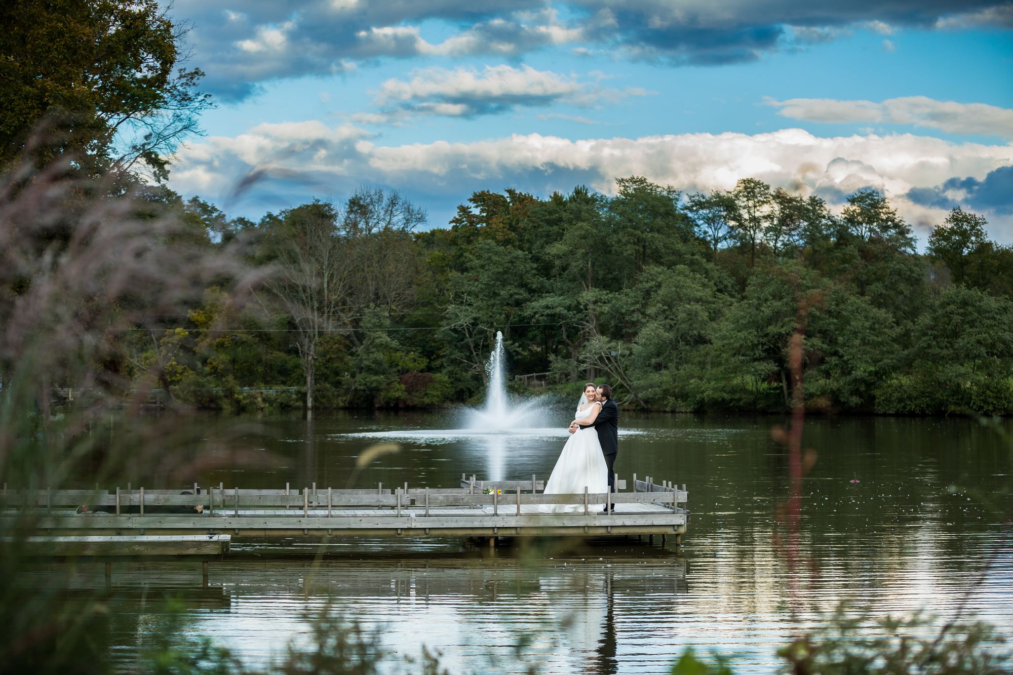 Bride and groom on the dock at the Estate at Eagle Lake in Chesterfield, New Jersey