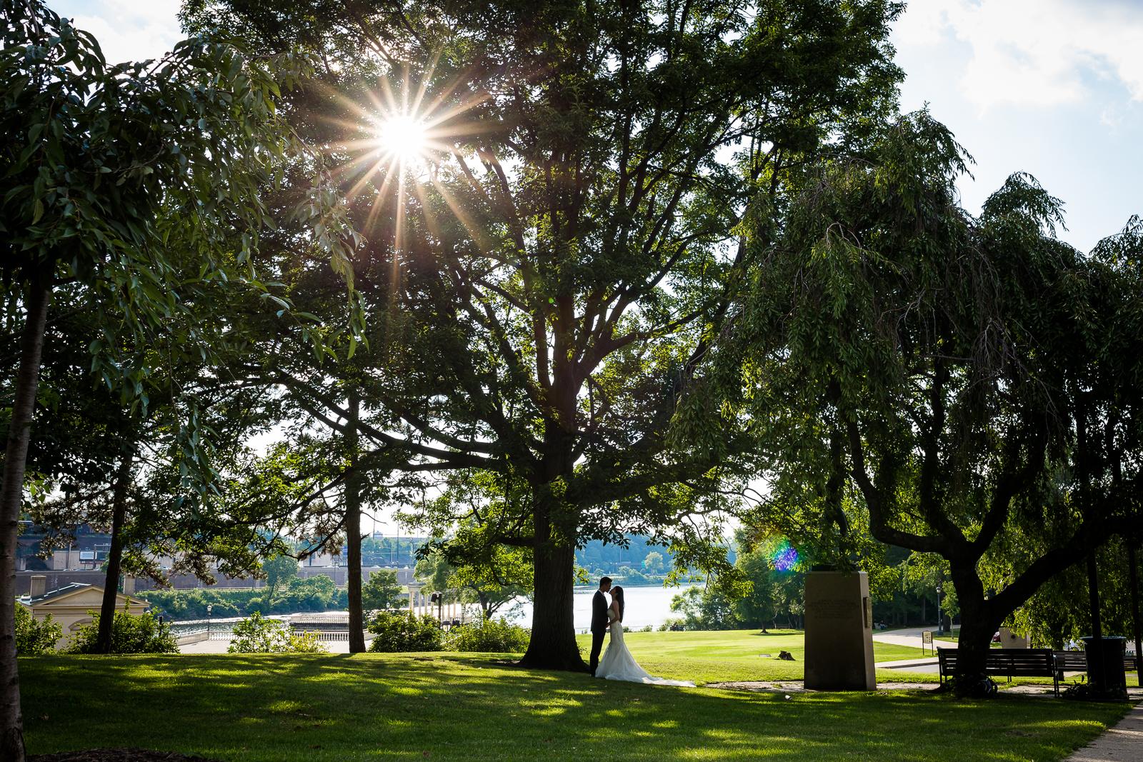 Bride and groom under the trees at Fairmount Water Works, Philadelphia