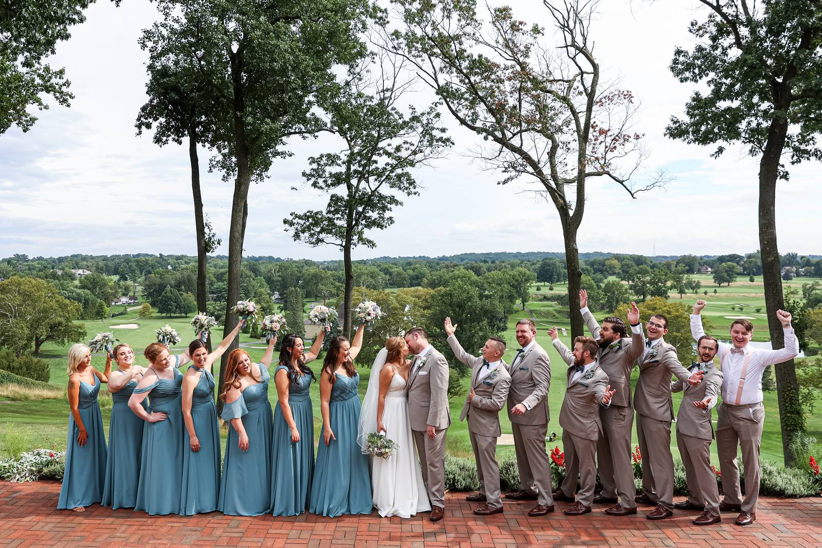 Wedding party celebrating above the fairway at Manufacturers' Golf & Country Club in Fort Washington, Montgomery County