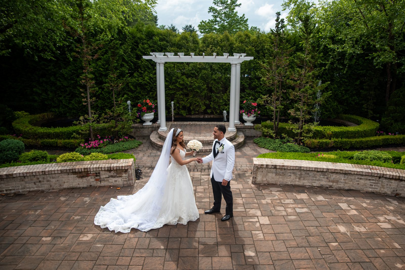 Bride and groom in the garden at South Gate Manor in Freehold, New Jersey